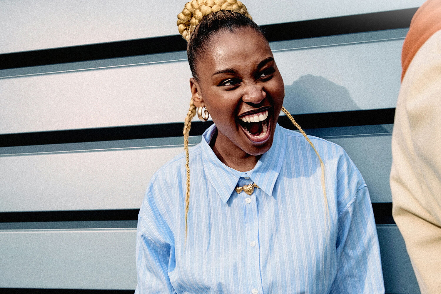 Woman with a broad smile and a cheerful expression on her face