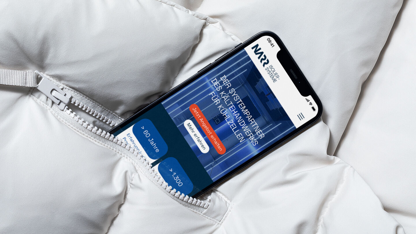 Smartphone partially visible in the pocket of a white down jacket, displaying the NARR landing page on the screen.